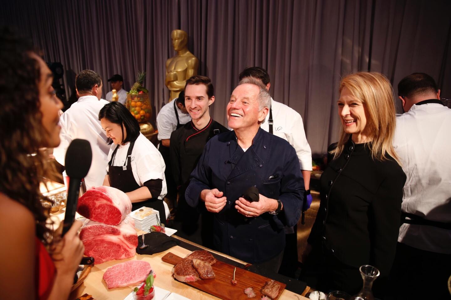 Chef Wolfgang Puck, center, with Motion Picture Academy CEO Dawn Hudson, right, fields questions from the media during a preview of the 90th Oscars Governors Ball celebration that follows the Oscars ceremony March 4.