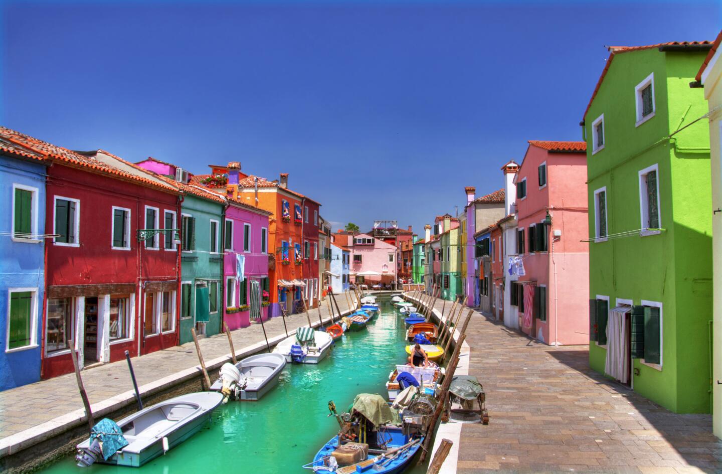 This island town looks more like a Crayola box than a typical Italian village. The vibrant hues date to a time when fishermen used them to find their way home through the fog. Today, the government keeps the tradition going. When homeowners want to paint their house a new color, they have to get government approval.