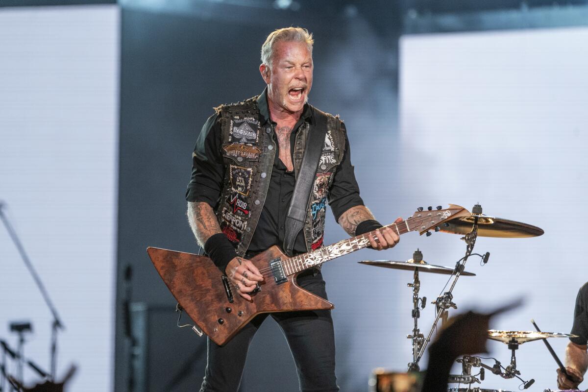 FILE - James Hetfield of Metallica performs at the Lollapalooza Music Festival in Chicago on July 28, 2022. Metallica, Mariah Carey and The Jonas Brothers will headline a free concert in New York’s Central Park to mark the 10th anniversary of the Global Citizen Festival on Sept. 24. (Photo by Amy Harris/Invision/AP, File)