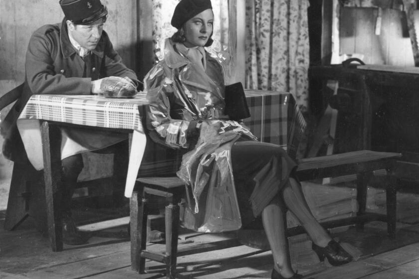 French actress Michele Morgan with Jean Gabin in a scene from "Quai des brumes" ("Port of Shadows"). She was the first winner of the Cannes best actress award.