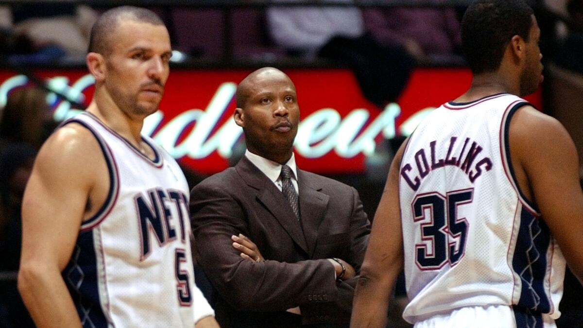 Byron Scott coaching the New Jersey Nets in 2003. In the foreground are Jason Kidd, left, and Jason Collins.