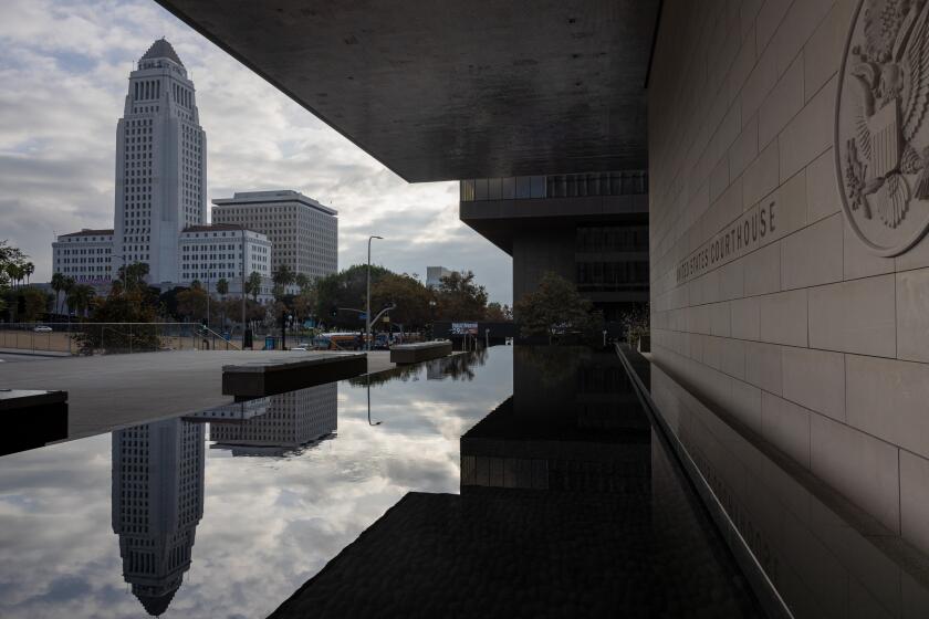 Los Angeles, CA - November 07: A view of City Hall and its reflection, from the United States Courthouse, also known as the First Street U.S. Courthouse, at 350 W. 1st St., in downtown Los Angeles, CA, Tuesday, Nov. 7, 2023. (Jay L. Clendenin / Los Angeles Times)