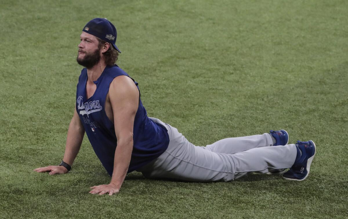 Dodgers starting pitcher Clayton Kershaw stretches before Game 3 of the NLCS.