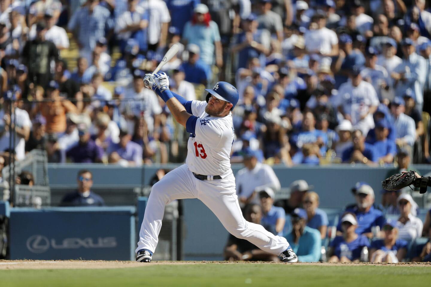 Dodgers first baseman Max Muncy (13) hits a two-run home run off Colorado Rockies starting pitcher German Marquez (48) in the fifth inning in a NL West tiebreaker game.