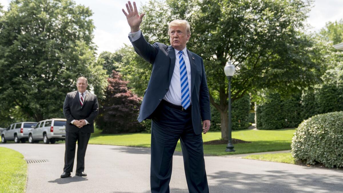 President Trump, accompanied by Secretary of State Mike Pompeo, outside the White House this week.