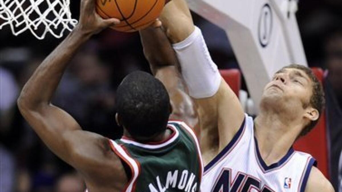 New Jersey Nets' Chris Douglas-Roberts dunks the ball during the