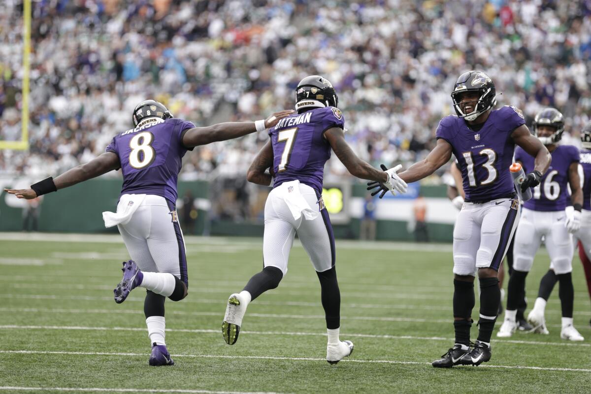 Defensive back Johnnie Jackson and cornerback Eric Davis of the