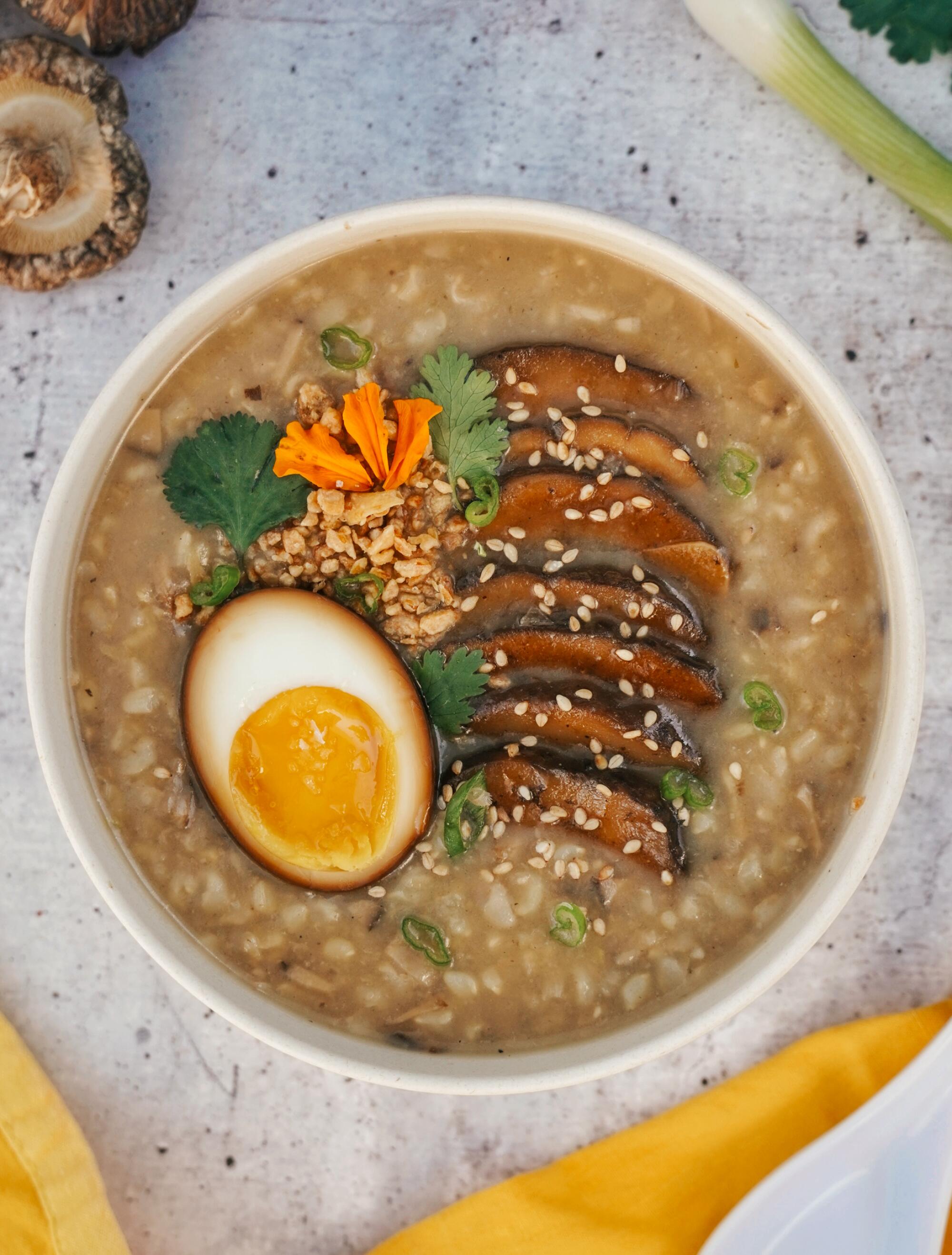 overhead view of porridge dish with an egg and mushroom