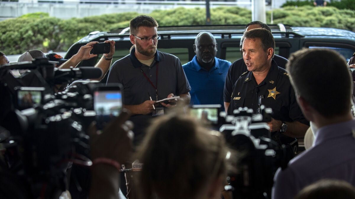 Jacksonville Sheriff Mike Williams, right, discusses the shooting Sunday in Jacksonville, Fla.