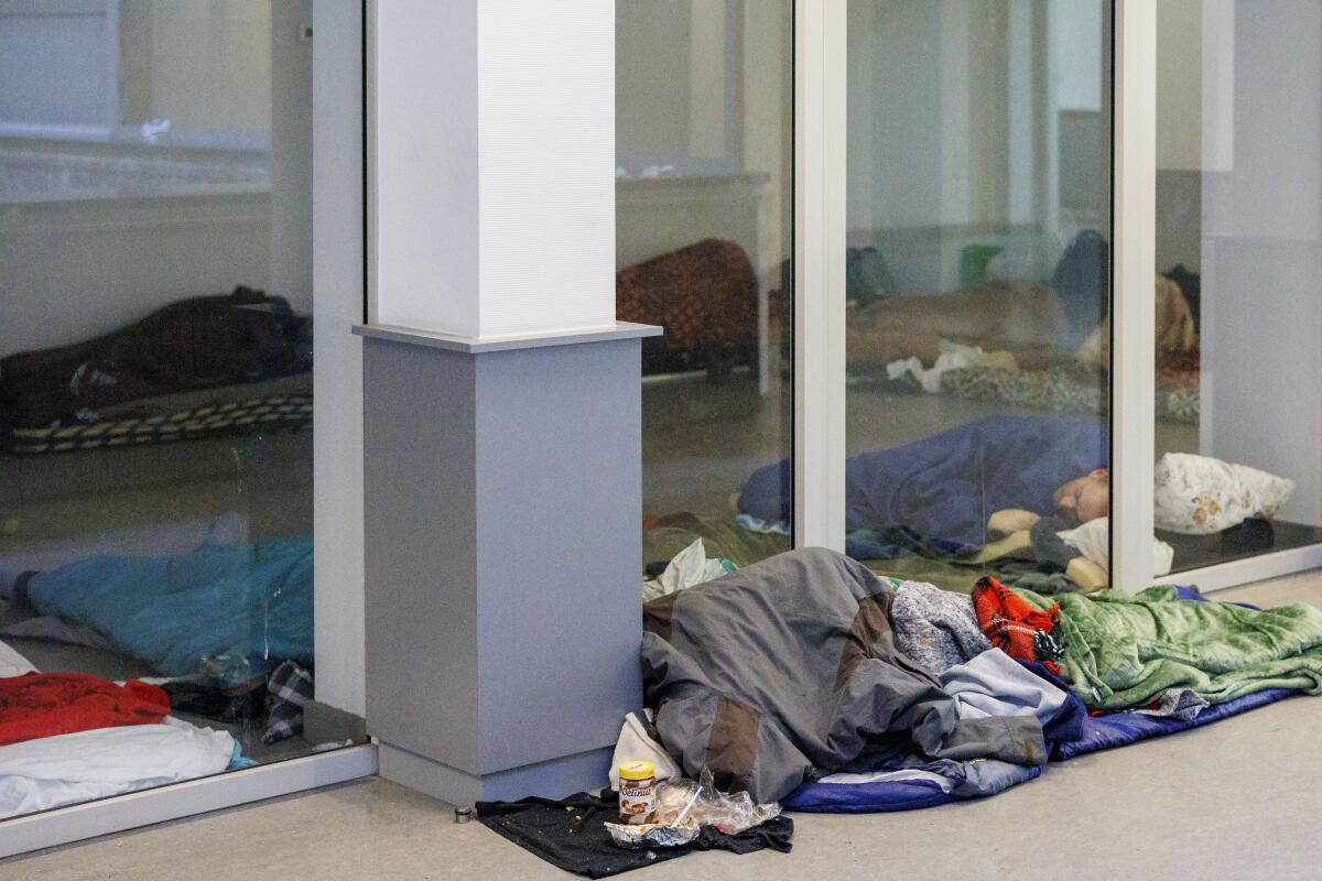 Migrants sleeping on the floor of a building in Brussels