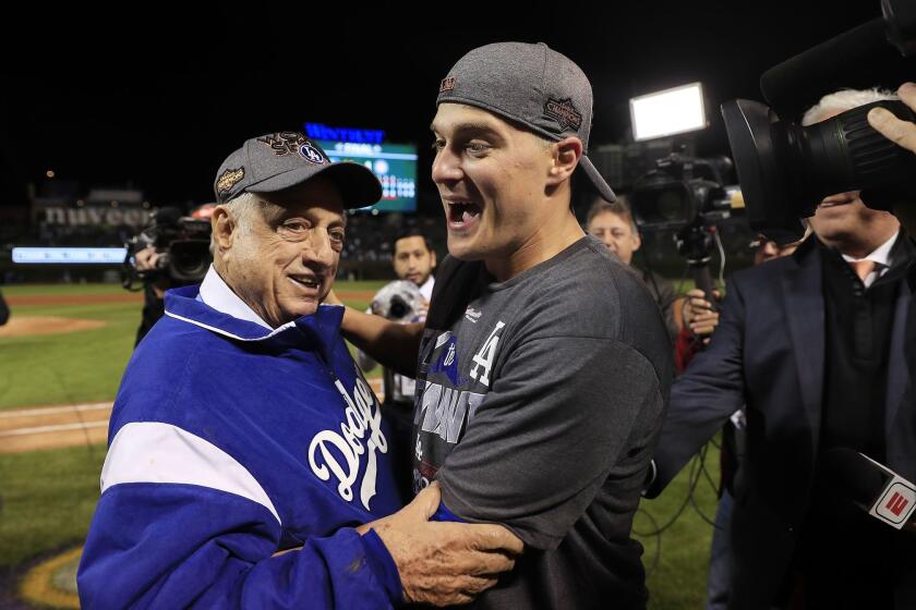 Mandatory Credit: Photo by TANNEN MAURY/EPA-EFE/REX/Shutterstock (9159557am) Enrique Hernandez and Tommy Lasorda Los Angeles Dodgers at Chicago Cubs, USA - 19 Oct 2017 Los Angeles Dodgers Enrique Hernandez (R) and former manager Tommy Lasorda (L) celebrate after defeating the Chicago Cubs in game five of the Major League Baseball (MLB) National League Championship Series (NLCS) playoffs at Wrigley Field in Chicago, Illinois, USA, 19 October 2017. The Dodgers win the National League Championship Series and go on to face either the New York Yankees or the Houston Astros in the World Series. ** Usable by LA, CT and MoD ONLY **