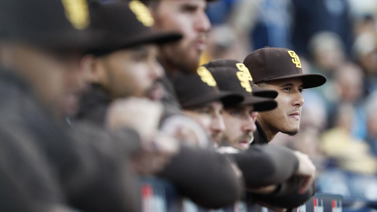 Xander Bogaerts and Manny Machado of the San Diego Padres react after  News Photo - Getty Images