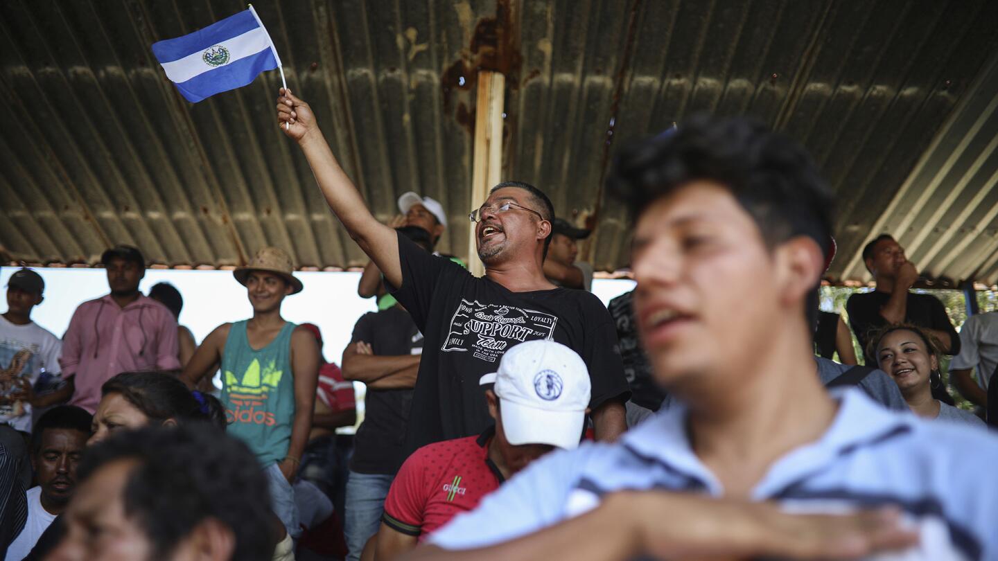 Central American migrants from El Salvador sing their national anthem during the annual Migrant Stations of the Cross caravan or "Via crucis," organized by the "Pueblo Sin Fronteras" activist group, as the group makes a few-days stop in Matias Romero, Oaxaca state, Mexico, Monday, April 2, 2018.