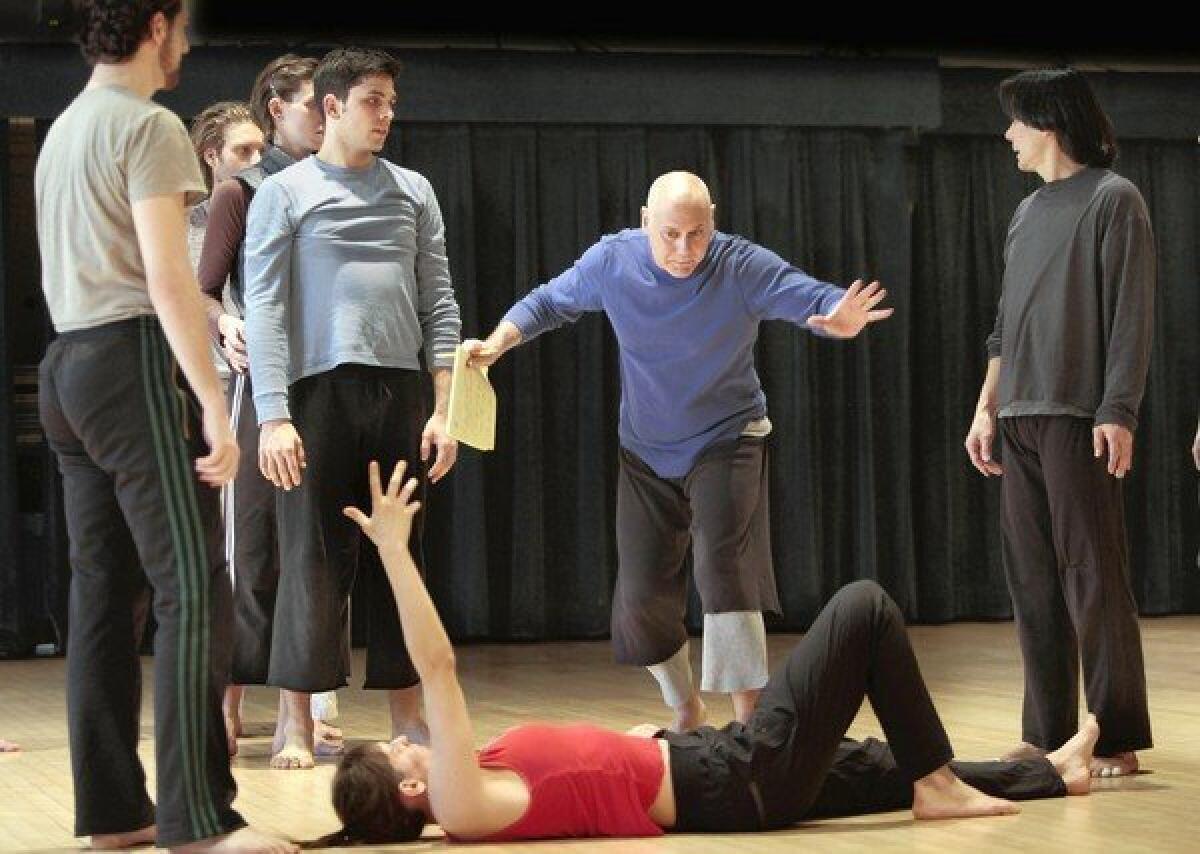 Choreographer-director Doug Varone (blue shirt) and members of his dance company rehearse in Buttenwieser Hall in New York.