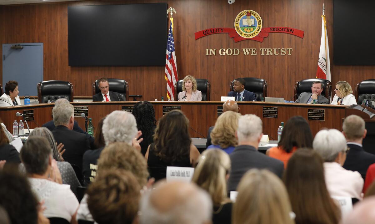 Crowds pack the O.C. Board of Education meeting room Tuesday in a panel talk on ethnic studies and critical race theory.