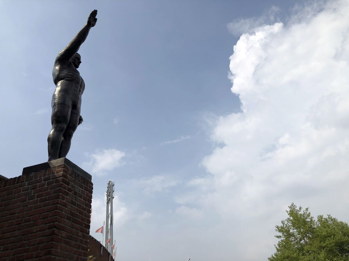 A statue is seen outside Amsterdam's Olympic Stadium in Amsterdam, Friday, Aug. 14, 2020. A spokeswoman for Amsterdam's Olympic Stadium says a bronze statute of an athlete saluting with an outstretched arm reminiscent of the gesture made infamous at rallies in Nazi Germany is to be removed from outside the stadium because the salute has links to fascism. The 3-meter (10-foot) tall bronze statue that was placed outside the stadium for the 1928 Summer Games that were staged in the Dutch capital. (AP Photo/Esther Corder)