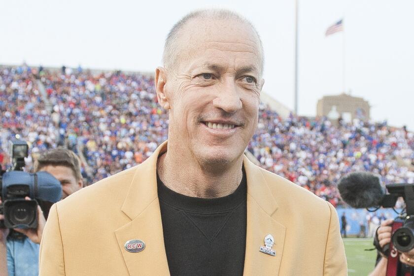 Former Buffalo Bills great Jim Kelly participates in the on-field coin toss before the Football Hall of Fame Game in Canton, Ohio, on Aug. 3.