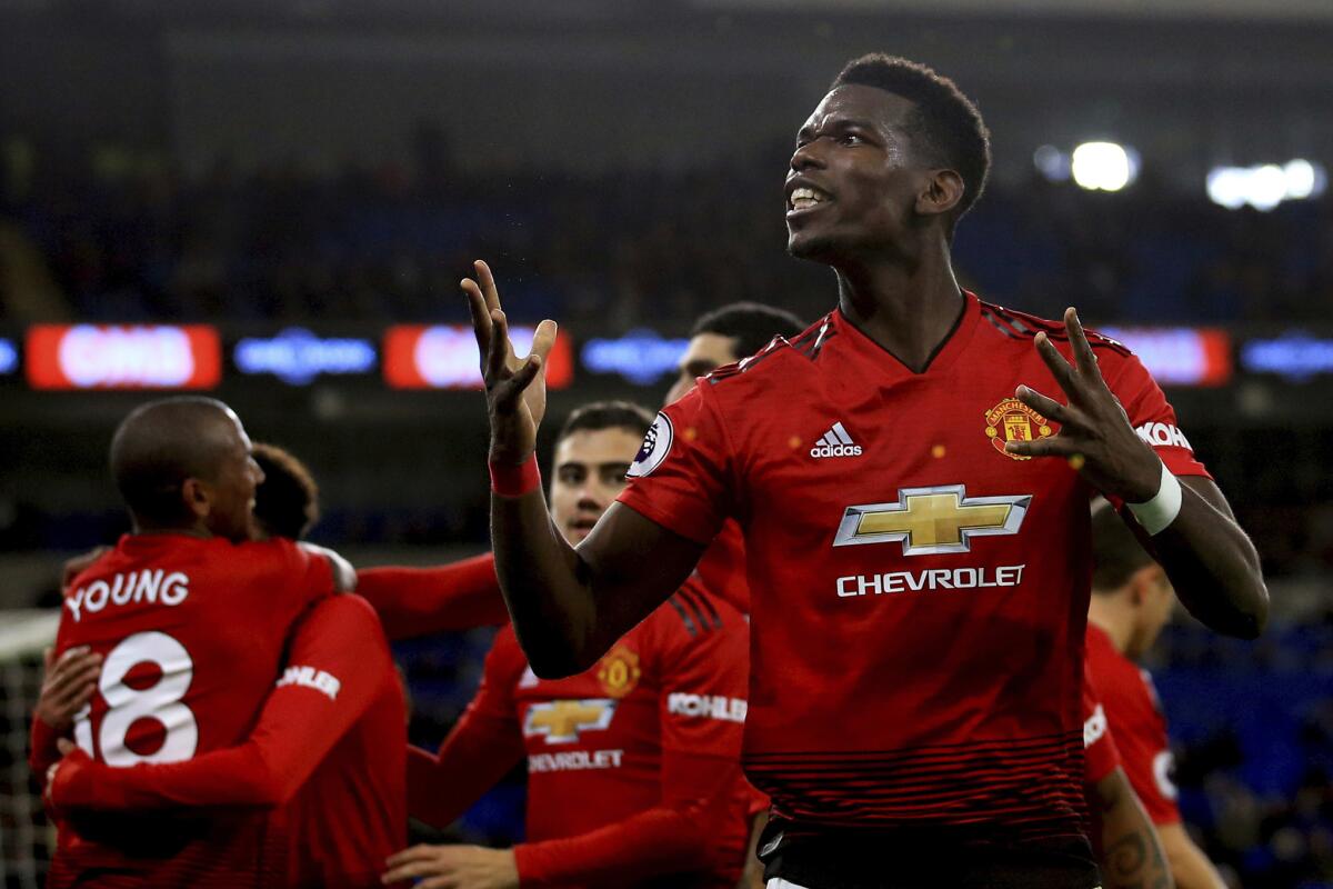 Manchester United midfielder Paul Pogba celebrates the fifth goal against Cardiff City during the English Premier League match between Cardiff City and Manchester United at the Cardiff City Stadium in Cardiff, Wales, Saturday Dec. 22, 2018.