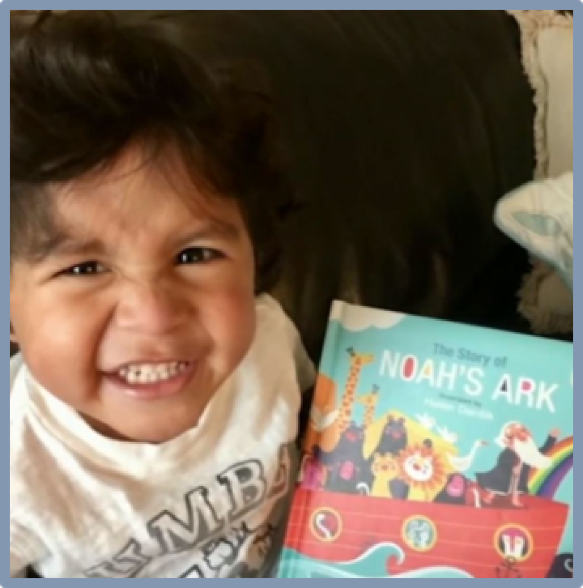 Noah Cuatro with the book "Noah's Ark"