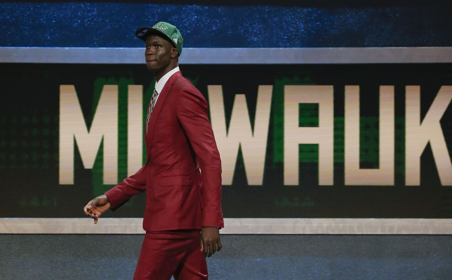 Thon Maker walks off stage after being selected 10th overall by the Milwaukee Bucks during the 2016 NBA Draft.