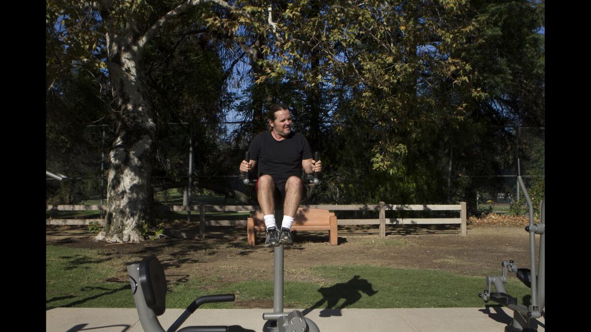 John Marshall does abdominal exercises at the workout station at Griffith Park. You can end your run or walk at this station, which brings you back to the beginning of the pathway.