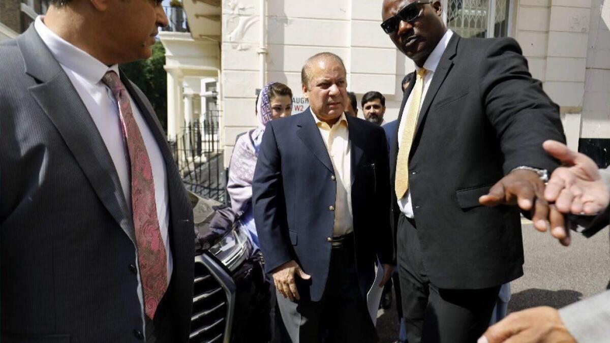 Pakistan's former Prime Minister Nawaz Sharif arrives at his office in London on July 6, before a court in Pakistan sentenced him and his daughter to jail on corruption charges.