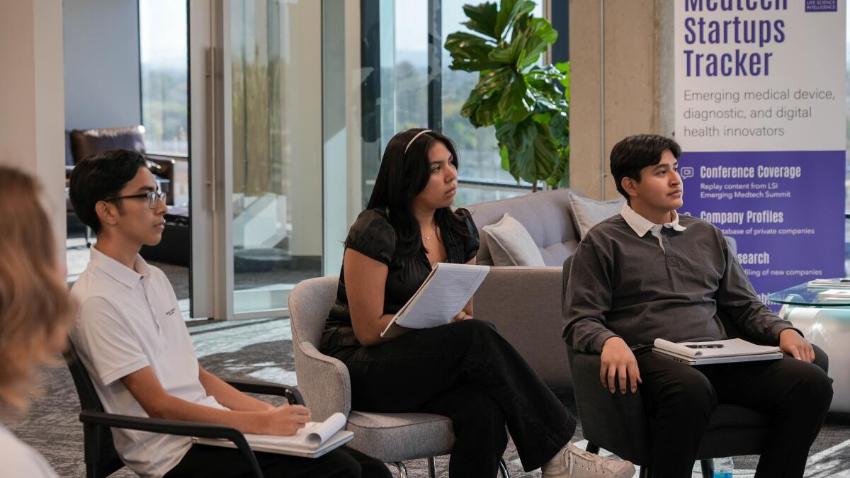 Ocean View High students Gerardo Flores, Odalys Lopez and Henry Salazar, left to right, listen during a session.