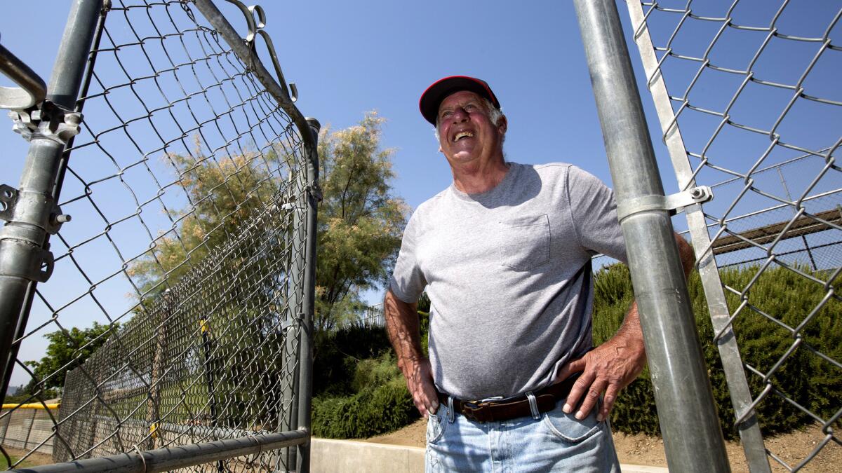 Ted Haller is retiring after 35 years of keeping the grounds at Glendora Little League fields. (Brian van der Brug / Los Angeles Times)