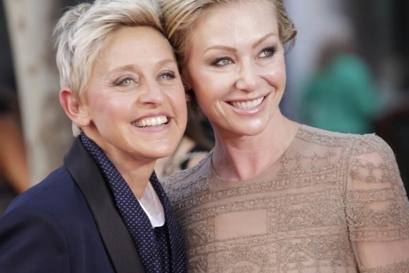 Ellen DeGeneres, left, shown with wife Portia de Rossi, stars in a Christmas commercial for J. C. Penney that has angered a Christian family group.