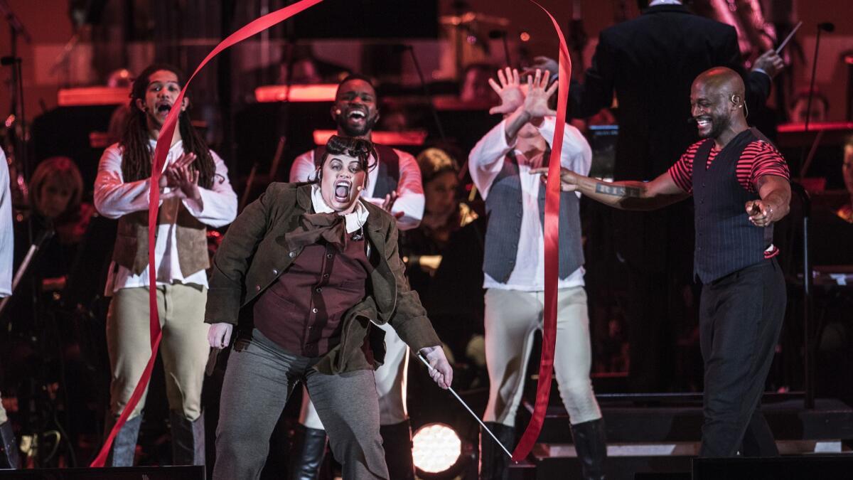 Rebel Wilson, left, who plays LeFou, with Taye Diggs, right, as Gaston.