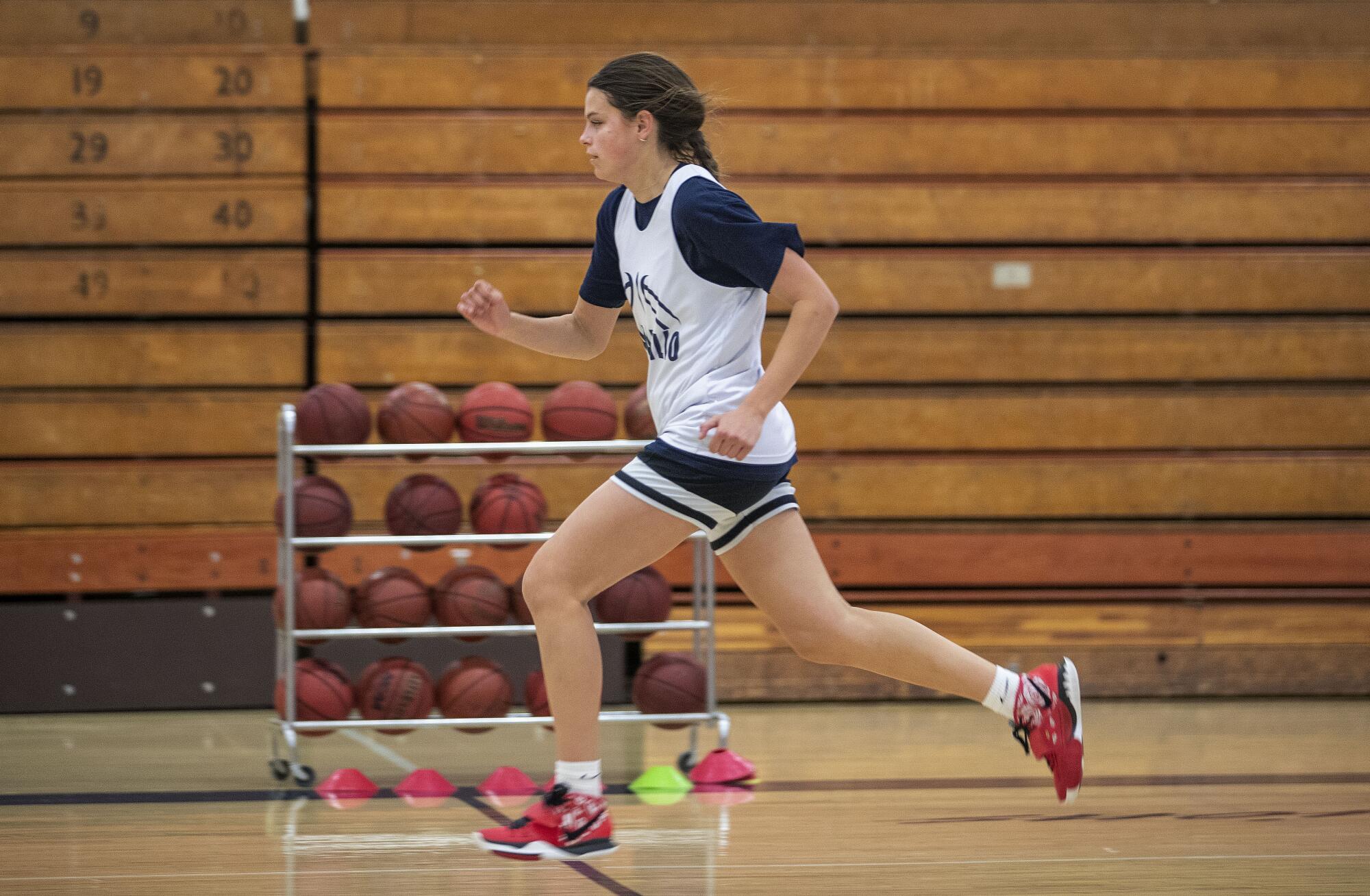 Gabriela Jaquez sprints down the court during a conditioning drill.