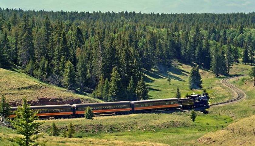 A steam locomotive chugs from the concert site at La Veta Pass.