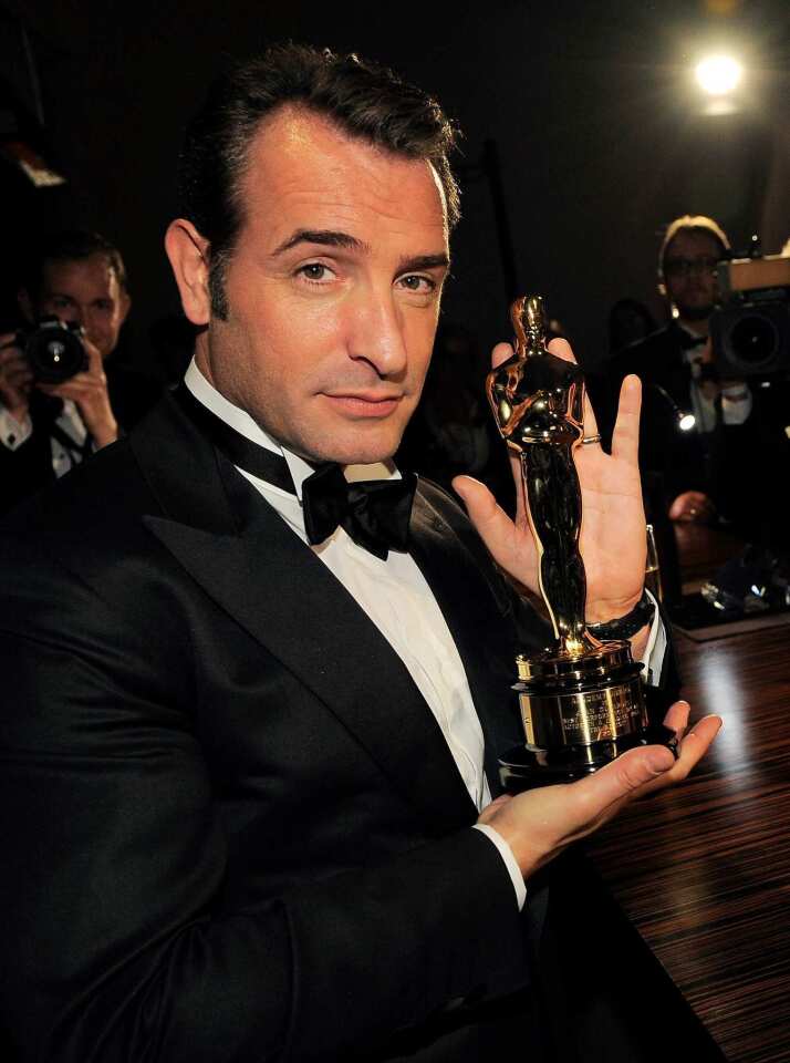 Lead actor winner Dujardin with his newly engraved best friend.