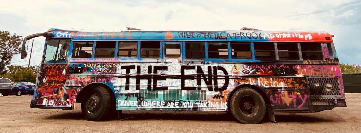 A public bus painted with the words "The End."