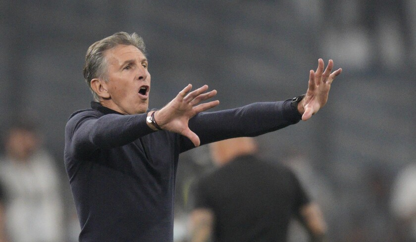 FILE - Saint-Etienne's head coach Claude Puel gives instructions from the side line during the French League One soccer match between Marseille and Saint-Etienne at the Velodrome stadium in Marseille, southern France, on Aug. 28, 2021. Last-place French club Saint-Etienne has confirmed the departure of coach Claude Puel just over a week after suspending him. The 60-year-old Puel and Saint-Etienne “mutually agreed” to end his tenure as coach and general manager. Puel joined 10-time French champion Saint-Etienne in October 2019. (AP Photo/Daniel Cole).