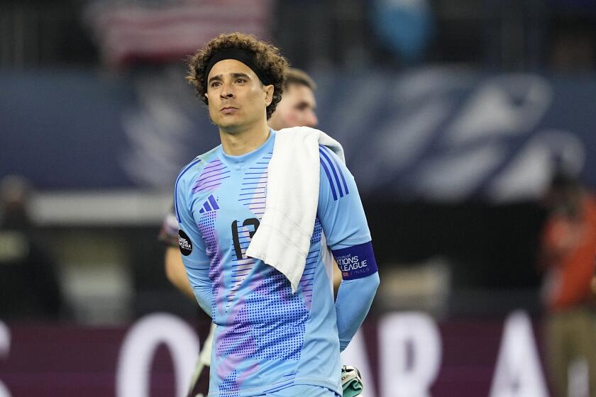FILE - Mexico's Guillermo Ochoa waits for the trophy presentation after a CONCACAF Nations League final soccer match against the United States, March 24, 2024, in Arlington, Texas. The veteran goalkeeper was left off the Mexico team for the Copa America, alongside strikers Raul Jimenez and Hirving Lozano, manager Jaime Lozano announced on Friday, May 10, 2024. (AP Photo/Tony Gutierrez, File)