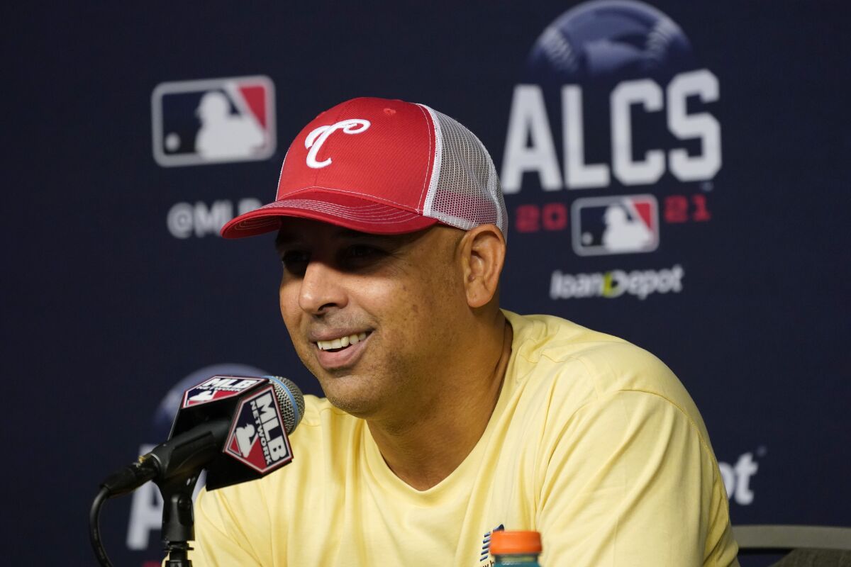 Boston Red Sox manager Alex Cora smiles as he responds to questions during a news conference before baseball practice in Houston, Thursday, Oct. 14, 2021. The Red Sox play the Houston Astros in Game 1 of the American League Championship Series on Friday. (AP Photo/Tony Gutierrez)
