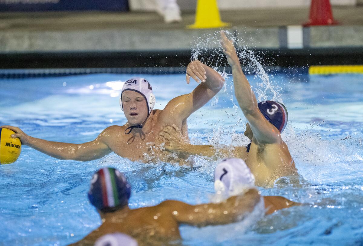 USA Water Polo's Chase Dodd is pressured by Italy's Luca Damonte during Tuesday's exhibition game.