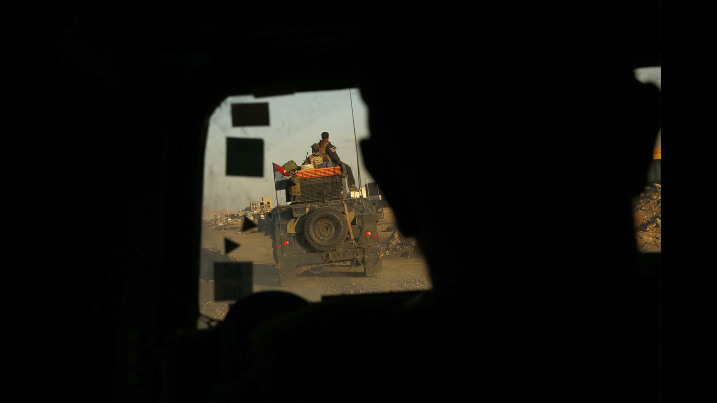 Iraqi forces patrol the Gogjali district of Mosul a day after it was liberated from Islamic State.