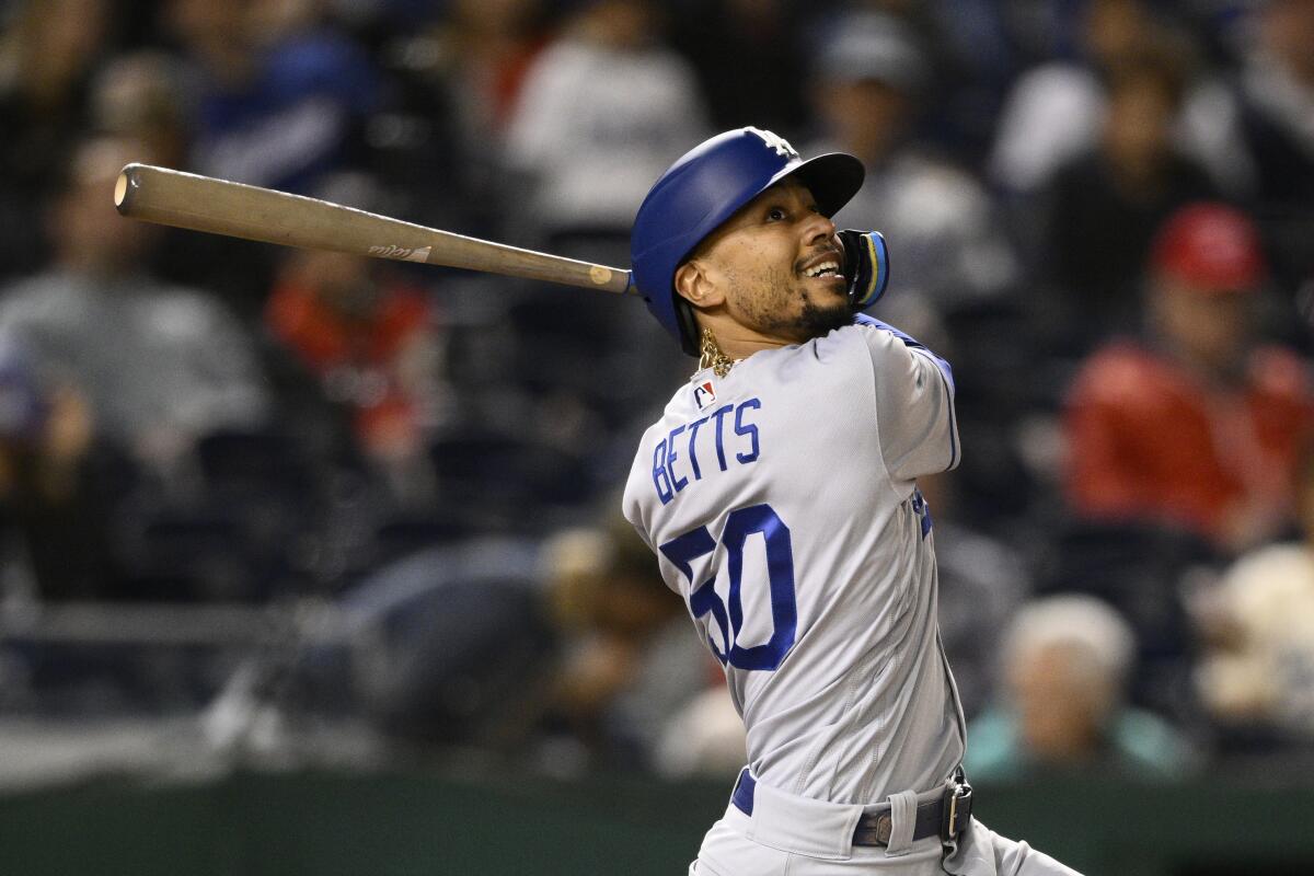 The Dodgers' Mookie Betts swings against the Washington Nationals on May 24, 2022.