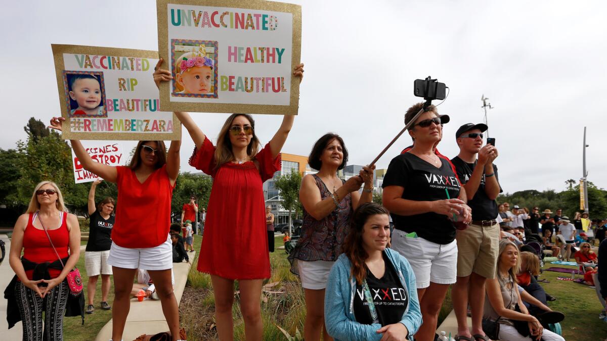 Parents protest in front of Santa Monica City Hall on Friday, the day SB 277 went into effect. The measure eliminates religious or personal belief exemptions from childhood vaccination requirements.