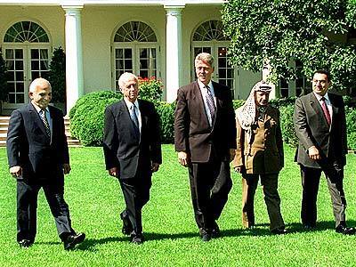 President Clinton leads Middle Eastern leaders into the White House Rose Garden where a Mideast accord was signed. From left are, King Hussein of Jordan, Israeli Prime Minister Yitzhak Rabin, the president, PLO Chairman Yasser Arafat and Egyptian President Hosni Mubarak.