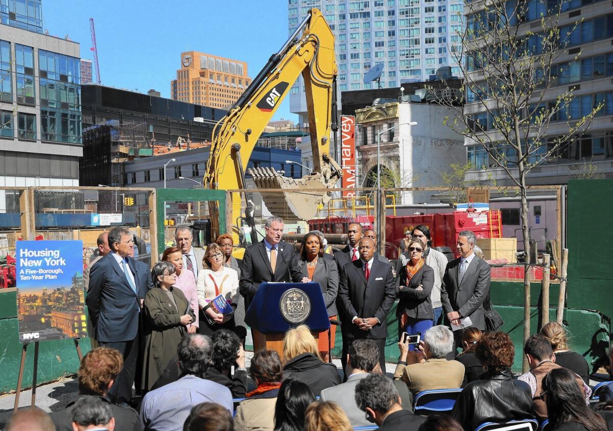 New York City Mayor Bill de Blasio unveils his affordable housing plan at a residential construction site in May.