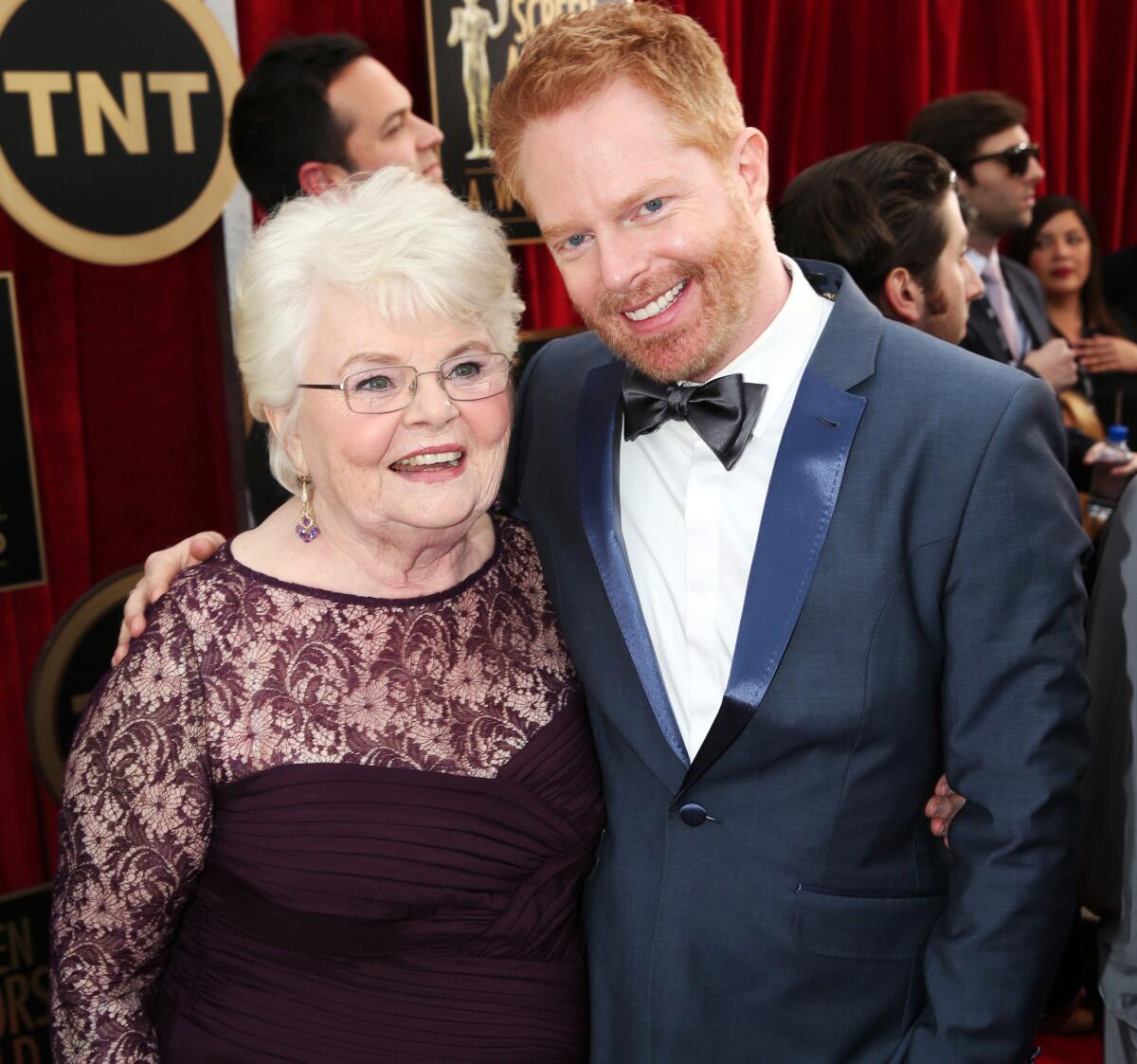 "Nebraska" actress June Squibb, left, poses with Jesse Tyler Ferguson of "Modern Family" at the 20th Screen Actors Guild Awards.