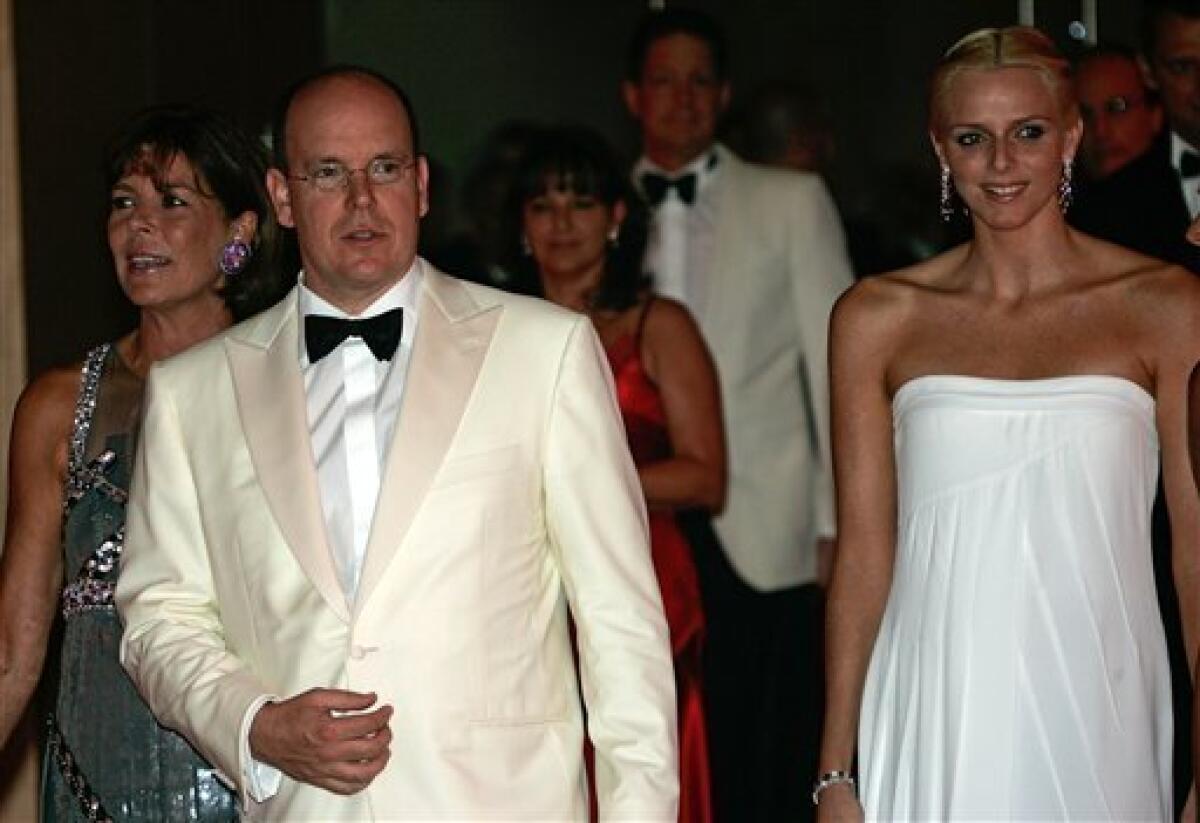 FILE - Prince Albert II of Monaco, center, arrives with his sister Princess Caroline of Hanover, left, and his friend Charlene Wittstock at the" Monte-Carlo Red Cross Gala", in this July 27, 2007 file photo taken in Monaco. The royal palace said Wednesday June 23, 2010 Prince Albert of Monaco is engaged to South African former swimmer Charlene Wittstock. (AP Photo/Lionel Cironneau, FILE)