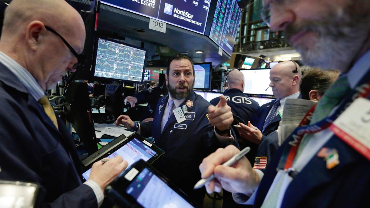 Traders on the floor of the New York Stock Exchange on Feb. 7.