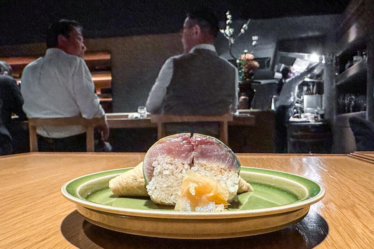 A variety of sushi styles, including pressed sushi, presented as a tasting-menu course at Tenoshima in Tokyo.