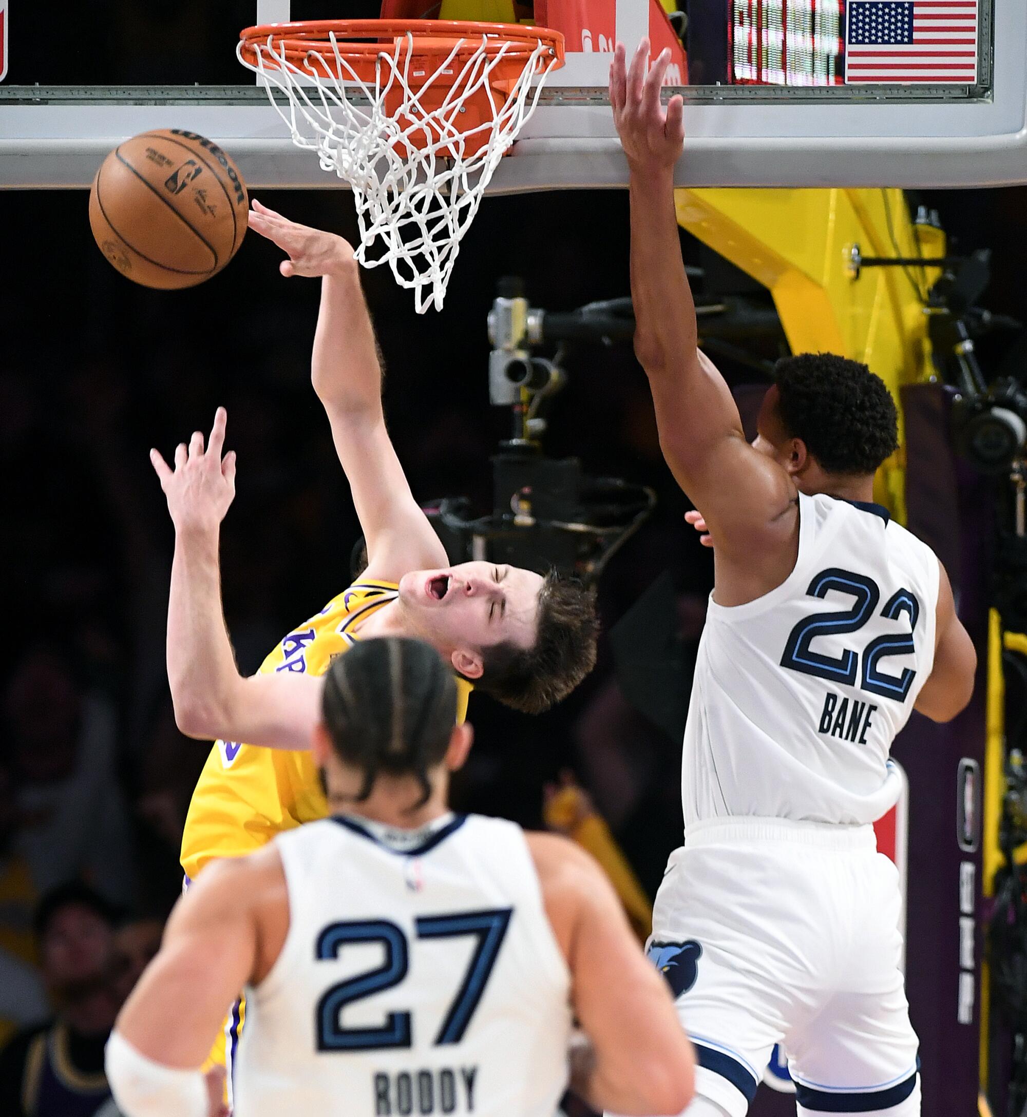 Lakers guard Austin Reeves is fouled by Grizzlies guard Desmond Bane in the second quarter.