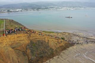 CALIFORNIA, USA - DECEMBER 28: Hundreds of people hike to trailhead to watch massive waves and surfers at Mavericks Beach of Half Moon Bay as high surf and coastal flood warning in California, United States on December 28, 2023. (Photo by Tayfun Coskun/Anadolu via Getty Images)