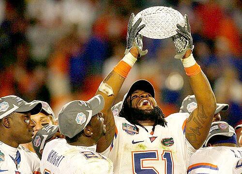 Florida linebacker Brandon Spikes hoists the BCS national championship trophy overhead during the awards ceremony Thursday night at Dolphin Stadium.